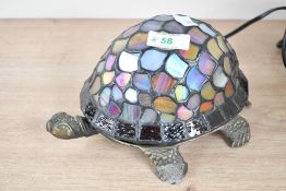 A late 20th-century Tiffany-style turtle table lamp, featuring a sweetly formed metal turtle base