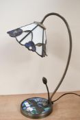 A 20th-century Tiffany-style table lamp, featuring a delicate blue floral flower-shaped shade,