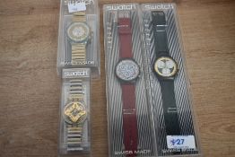 A group of four Swatch watches, comprising Flex White Onyx, Golden Globe, Atz Eco and Rollerball,