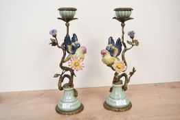 An exquisite pair of 20th-century William Lowe-style Wong Lee bronze and porcelain candle holders