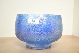 A vintage Cumbria studio art glass decorative bowl, featuring an iridescent finish with a textured