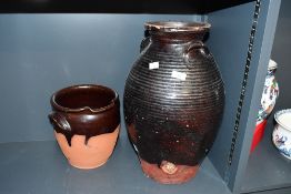 A large late 19th-century English country pottery Buckley brewing jar, having a deep brown glaze