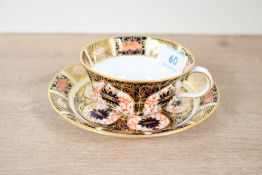 A 20th-century Royal Crown Derby china 'Old Imari' pattern 1128 cup and saucer, both marked to base,