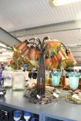 A contemporary Lesser and Pavey Art Nouveau Tiffany-style lamp, featuring a selection of lily-formed