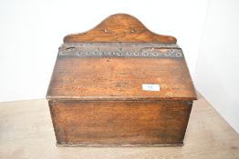 A late 19th to early 20th-century oak ecclesiastical offertory box, fitted with leather and brass
