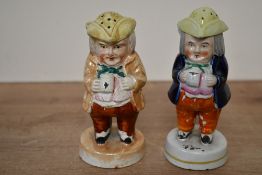 Two late 19th-century Staffordshire pottery-style 'Toby' pepper pots, both unmarked, (2),