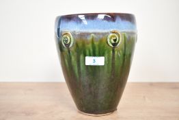 A small vintage studio pottery jardinière, featuring a blue and green drip glaze with spiral-