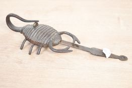 An unusual vintage metal brass Scorpion-shaped padlock, unmarked, approximately 20cm in length.