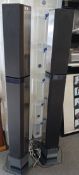 A pair of Bang and Olufsen floor standing speakers - some wear to the grills , sold as seen