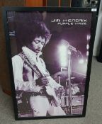 A large framed poster of Jimi Hendrix measuring : 66 x 97 cm