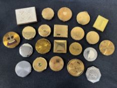 A collection of 20th century British Made and Themed compacts in gold tone, engine turned gilt and