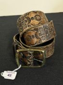 A circa 1960-70s Western style tooled leather belt having black intricate floral and geometric