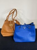 Two brightly coloured textured leather handbags comprising a 'Prada' tote in cobalt blue with