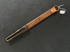 A mid-century vintage teak handled clothes brush with English napped leather backing, nylon