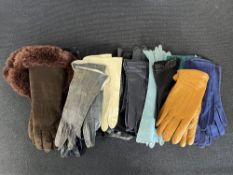 Assorted fine leather dress gloves along with three pairs of winter gloves.