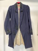 An Edwardian era Suffragette's coat in midnight blue suiting wool featuring panelled shawl lapels,