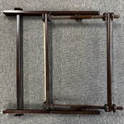 A vintage adjustable tapestry frame in dark wood with metal fixings, frame measures 29 x 19.5