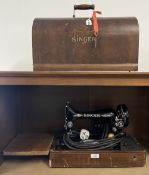 A Singer 99K portable electric sewing machine in original domed wood box with key, black lacquered
