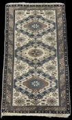 A 20th century Anatolian hand knotted flatweave wool rug featuring a three medallion central