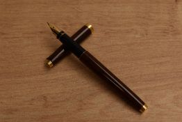 A Parker 75 converter fill fountain pen in Thuya Laque having Parker 14K 585 nib. Circa 1989