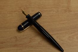 A Wahl Eversharp Skyline lever fill fountain pen in Dark Blue with single cap band having