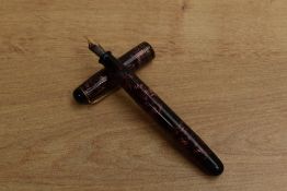 A Parker Televisor button fill fountain pen in Red Hatched with three cap bands having Parker