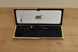 A boxed Montblanc Meisterstuck 146 piston fill fountain pen in Black with bi colour 4810 14K