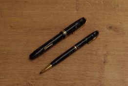 A Conway Stewart 58 lever fill fountain pen and pencil set in Blue Marble with a broad and two