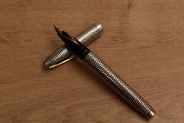 A Sheaffer Imperial diamond converter fill in Sterling Silver having Sheaffer 14K 585 nib. Circa