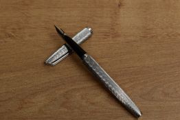 A Waterman converter fill fountain pen in nickel plated Moire pattern having 18K 750 nib. Circa