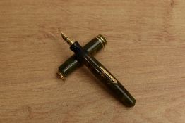 A Wahl Lady lever fill fountain pen in Green and Gold Marble with two narrow cap bands to ring top
