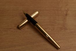 A Parker 65 converter fill fountain pen in Rolled Gold having Parker 14K 585 nib. Circa 1967