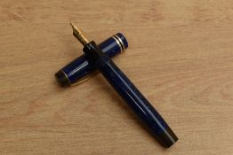 A Parker Duofold Junior Streamline button fill fountain pen in Lapis Lazuli Blue with two bands to