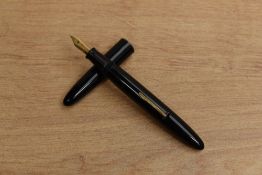 A Sheaffer lever fill fountain pen in Black having Sheaffer 33 Made in USA 14K nib.