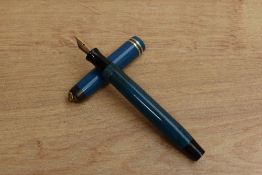 A Parker Moire button fill fountain pen in Blue with two bands to a ring top cap. Circa 1932