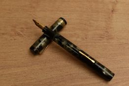 A Nicaea lever fill fountain pen in Grey Marble with two cap bands having Nicaea 18CT nib. Circa