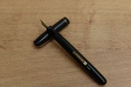A Waterman 513 lever fill fountain pen in Dark Green with two cap bands having Waterman 14ct W-2A