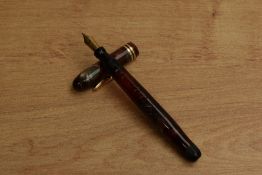 A Conklin Endura Wordguage twist fill fountain pen in Green and Red Marble with two narrow cap bands