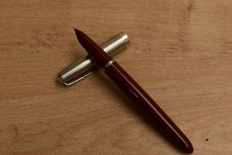 A Parker 21 Standard MkI aerometric fill fountain pen in Red with lustraloy cap. Circa 1948