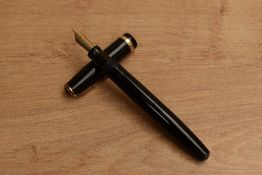 A Parker Duofold button fill fountain pen in Black with broad cap band having Parker Duofold 14K Pen