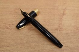 A Sheaffer Pen For Men III snorkel fill fountain pen in Black with gold trim having Sheaffer 14k