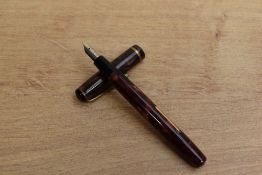 A Burnham No44 lever fill fountain pen in Rose marble with single cap band having Burnham Medium S20