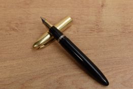 A Sheaffer Crest plunger fill fountain pen in Black with gold cap having Sheaffer Lifetime Made in