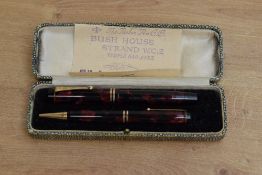A boxed Parker Junior button fill Fountain pen and pencil set in Burgundy and Black Marble with