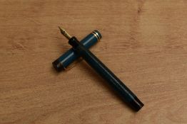 A Parker Pastel Lucky Curve button fill fountain pen in Naples Blue with two gold an one black cap
