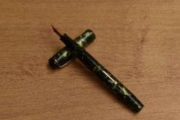A Conway Stewart 479 lever fill fountain pen in Green Marble having Conway Stewart 14CT Gold 1