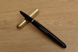 A Parker 51 aerometric fill fountain pen in Black with Rolled Gold converging line cap. Circa 1953