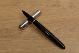 A Parker 51 Aerometric fill fountain pen in Black with a lustraloy cap. Circa 1948. Engraved