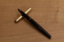 A Parker 61 Custom cartridge fill fountain pen with converging line rolled gold cap. Circa 1958