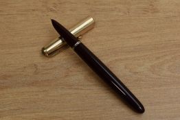 A Parker 51 Aerometric fill fountain pen in Burgundy with gold filled converging lined cap. Circa